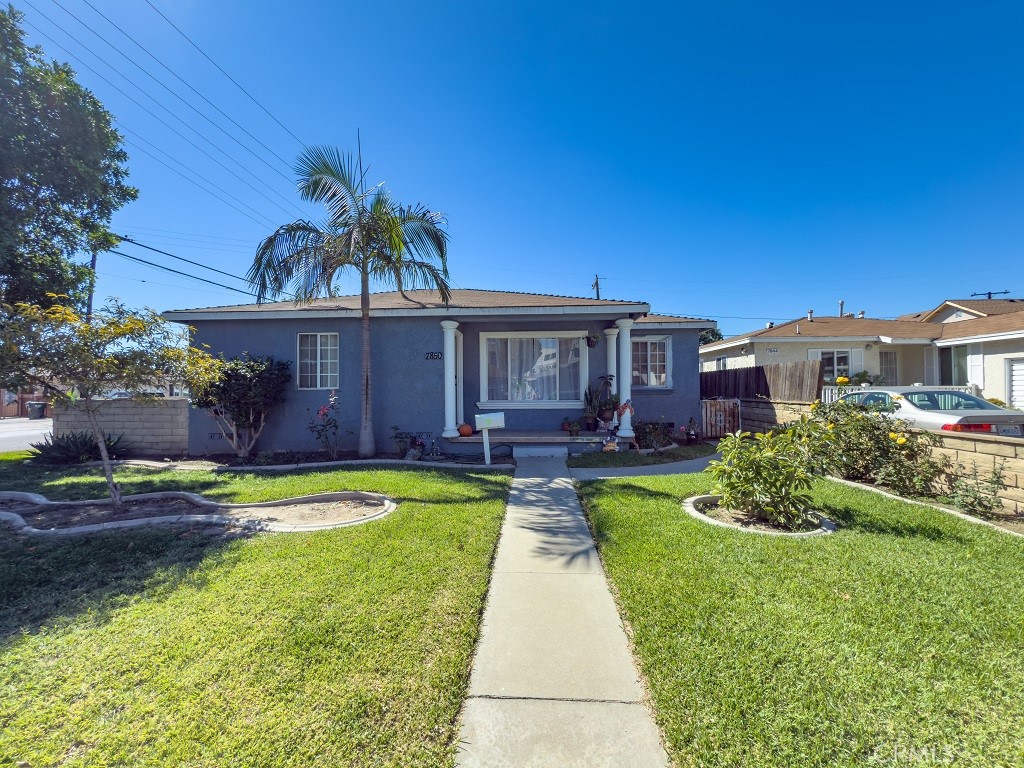 7850 Birchcrest Road Downey, CA 90240 - Photo 4 of 18 a view of a house with swimming pool