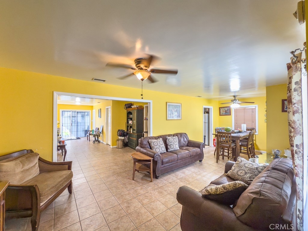 7850 Birchcrest Road Downey, CA 90240 - Photo 7 of 18 a living room with furniture and a large window