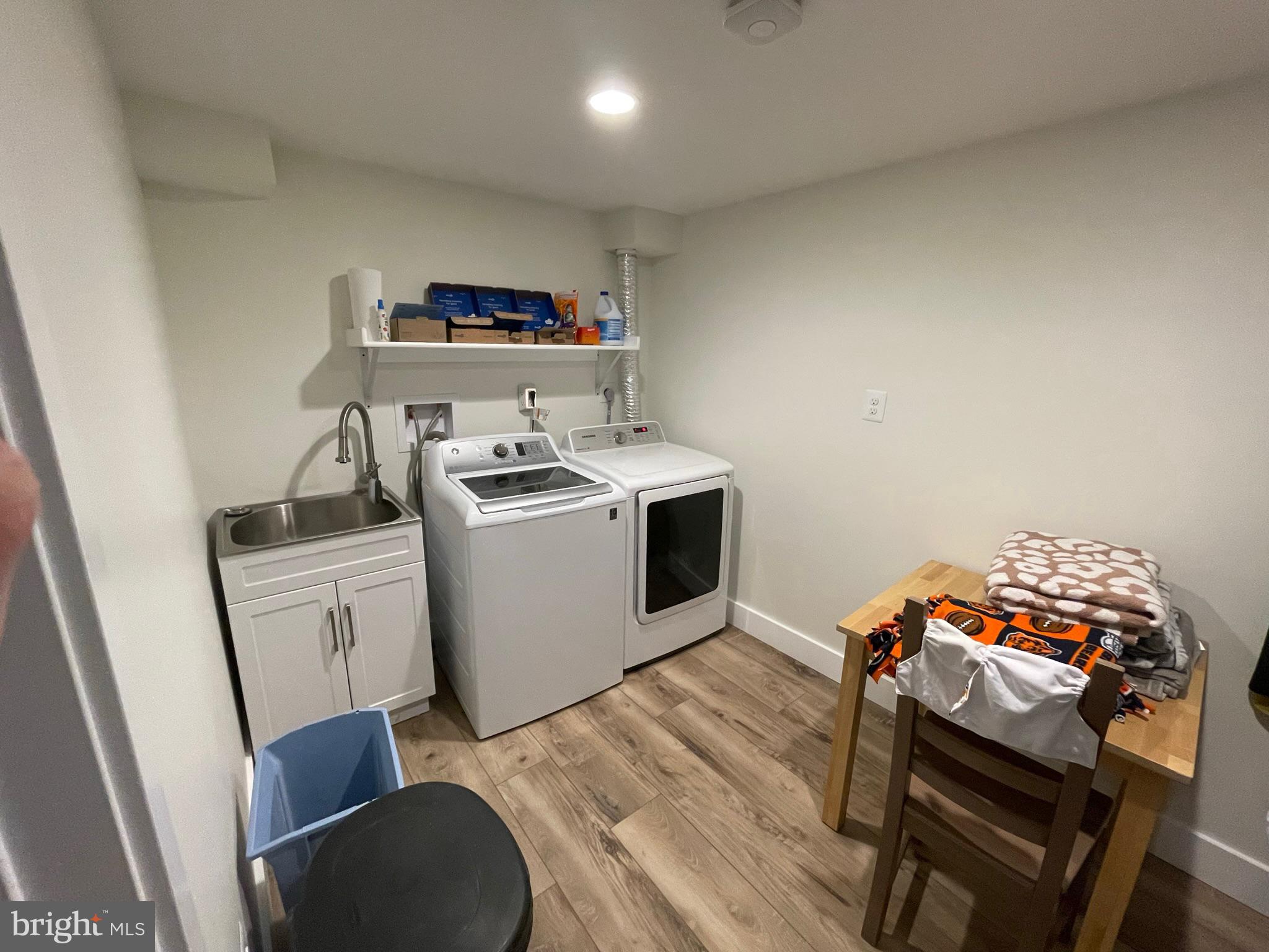 2314 Wheystone Court Vienna, VA 22182 - Photo 61 of 72 Laundry Room with Clothes Hanging & Storage Shelve