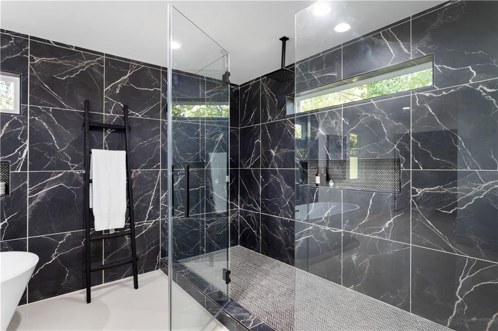 399 Old Canton Road Marietta, GA 30068 - Photo 16 of 26 a bathroom with a shower and a sink