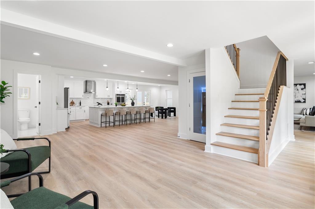 399 Old Canton Road Marietta, GA 30068 - Photo 5 of 26 a living room with furniture and a wooden floor