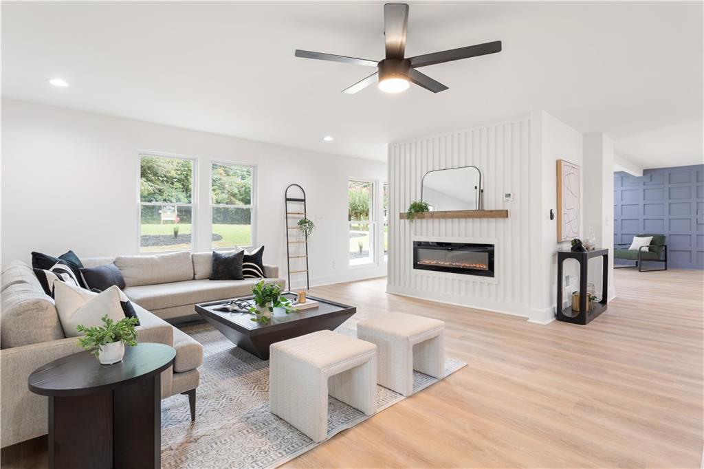 399 Old Canton Road Marietta, GA 30068 - Photo 8 of 26 a living room with furniture and a fireplace