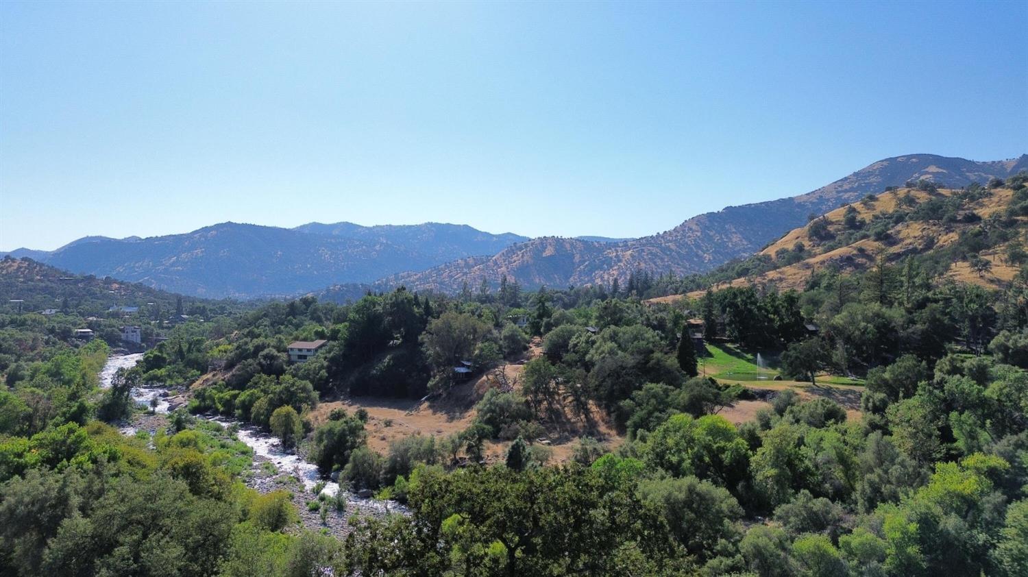 369 August Drive Three Rivers, CA 93271 - Photo 10 of 12 a view of a lush green field with mountains in the background
