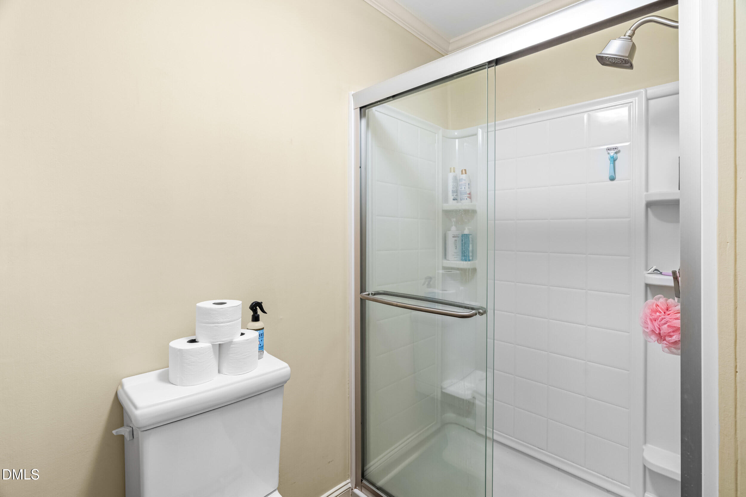 710 Powell Drive, Unit C Raleigh, NC 27606 - Photo 17 of 24 a bathroom with a sink mirror and shower