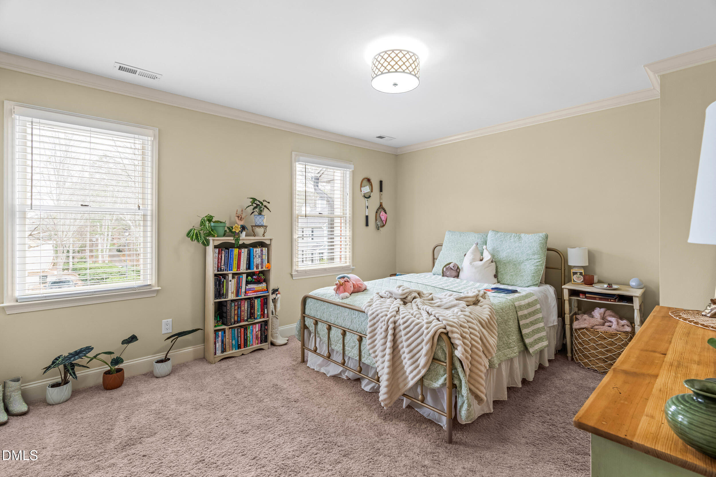 710 Powell Drive, Unit C Raleigh, NC 27606 - Photo 18 of 24 a bedroom with a bed and a window