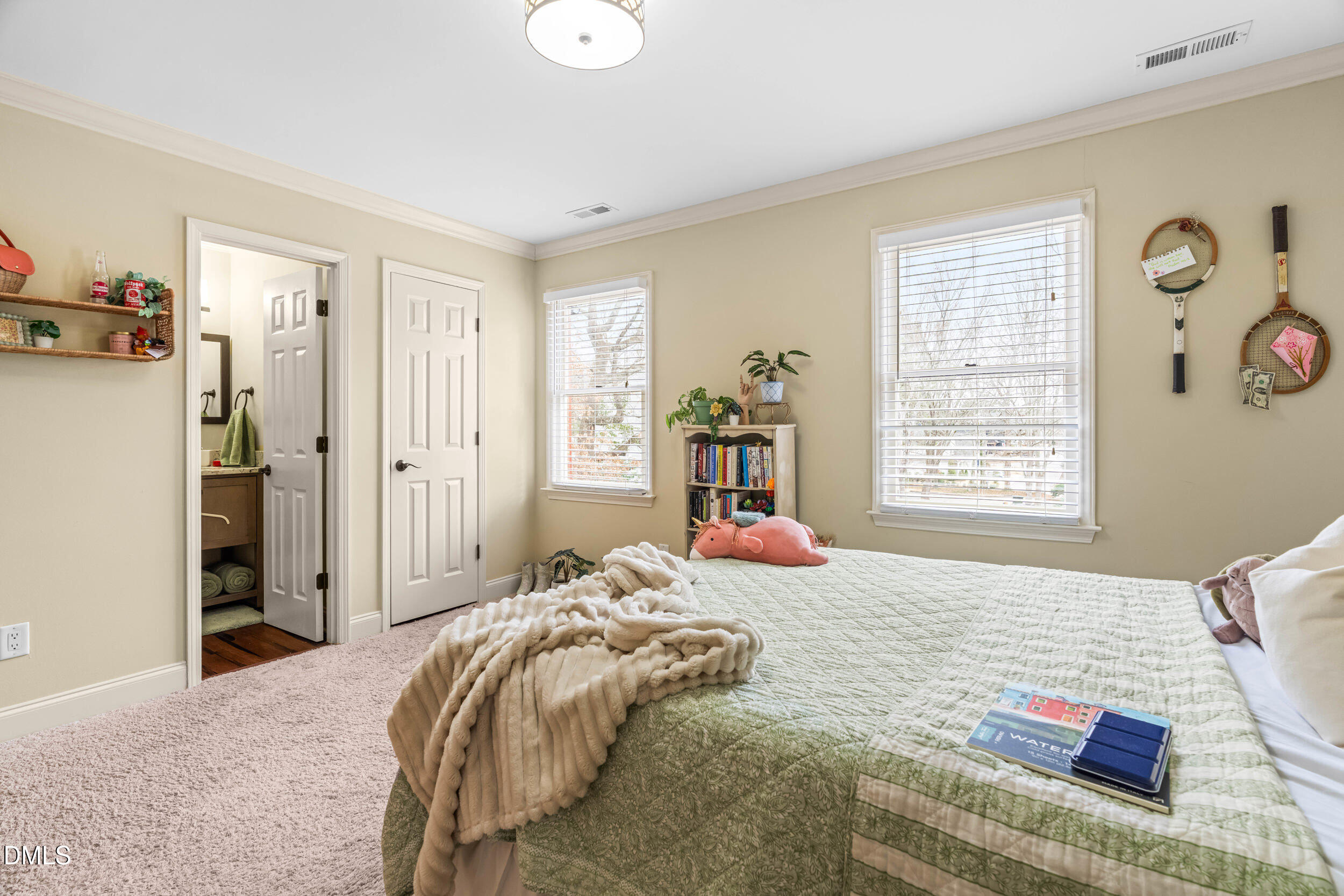 710 Powell Drive, Unit C Raleigh, NC 27606 - Photo 19 of 24 a bedroom with a bed and a window