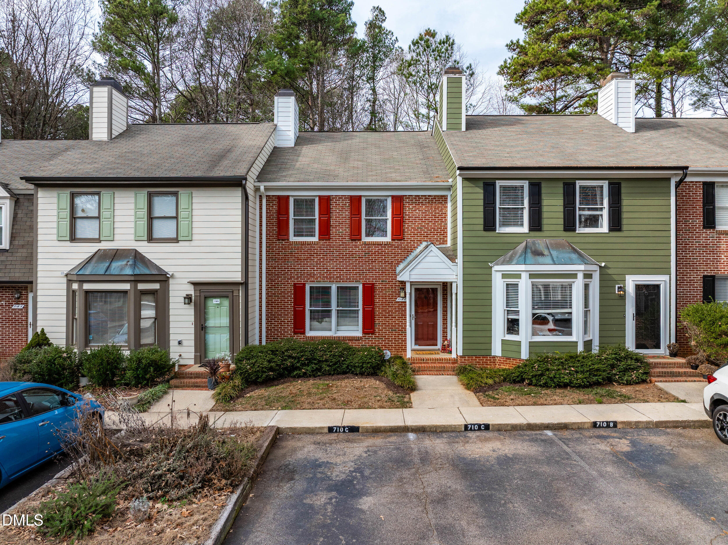 710 Powell Drive, Unit C Raleigh, NC 27606 - Photo 2 of 24 a front view of a house with a yard and trees