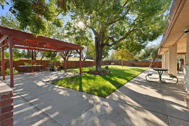 a view of yard with patio