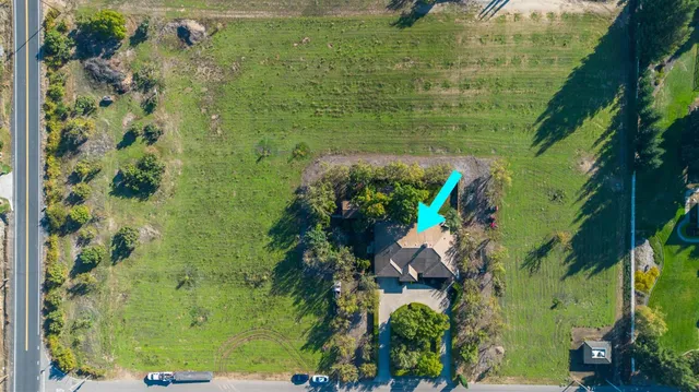 an aerial view of a golf course with parking space