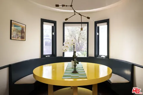 a dining room with table and chair