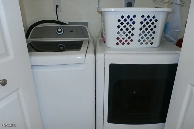 a utility room with dryer and washer