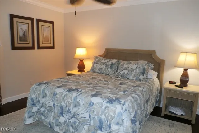 a bedroom with a bed and a lamp