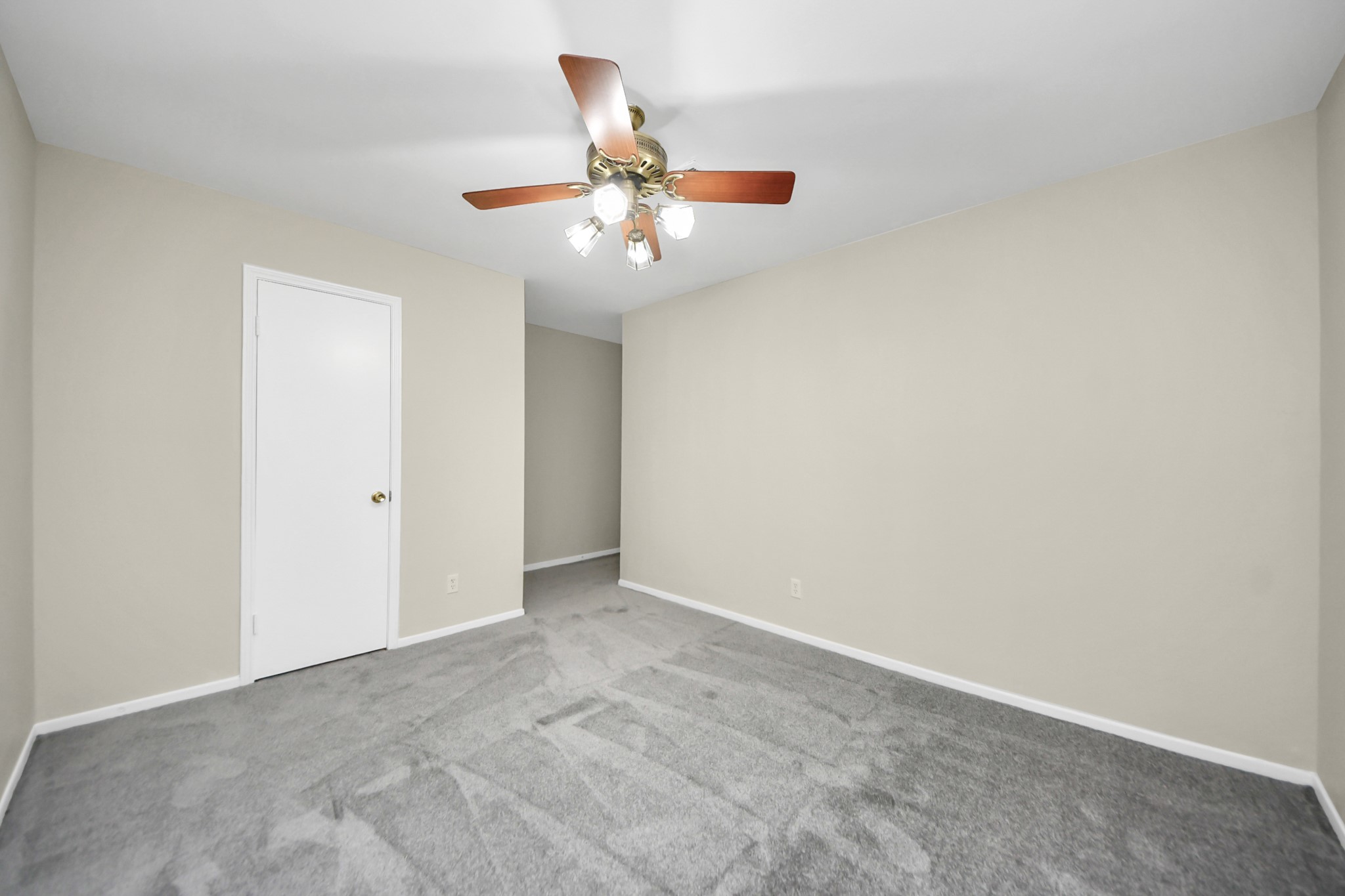 8234 Fondren Road, Unit 8234 Houston, TX 77074 - Photo 8 of 10 an empty room with closet and ceiling fan