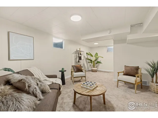 a living room with furniture and a chair