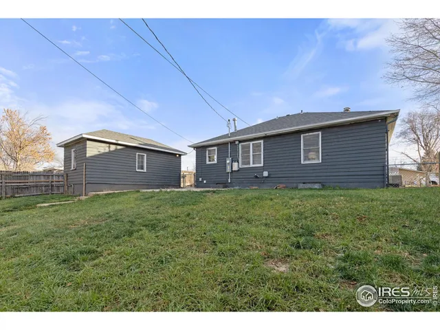 a view of a house with a backyard