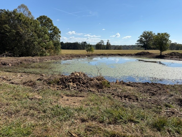 549 Virgil Smith Road Crossville, TN 38571 - Photo 21 of 26 a view of a lake with houses in the back