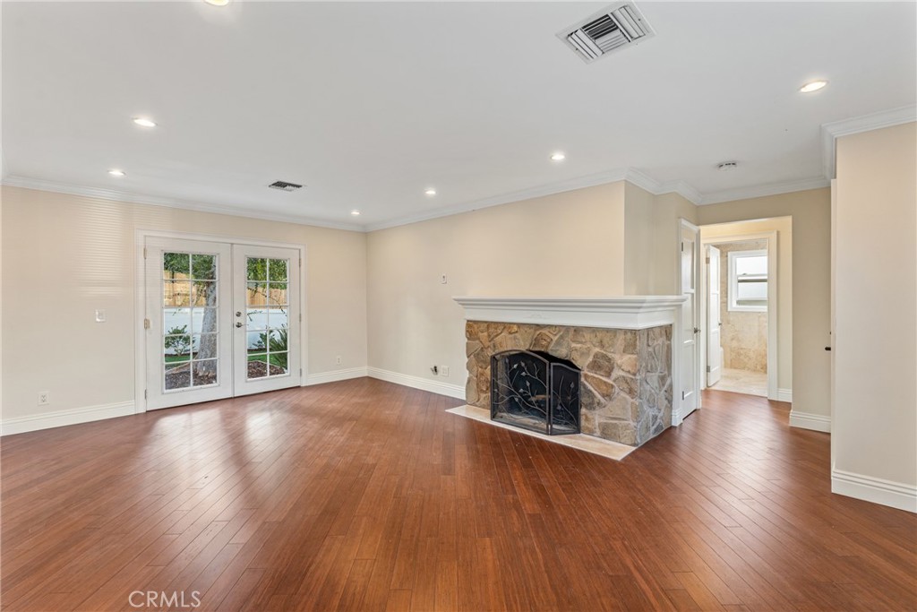 510 Lime Street Redlands, CA 92374 - Photo 12 of 50 a view of an empty room with wooden floor and a window