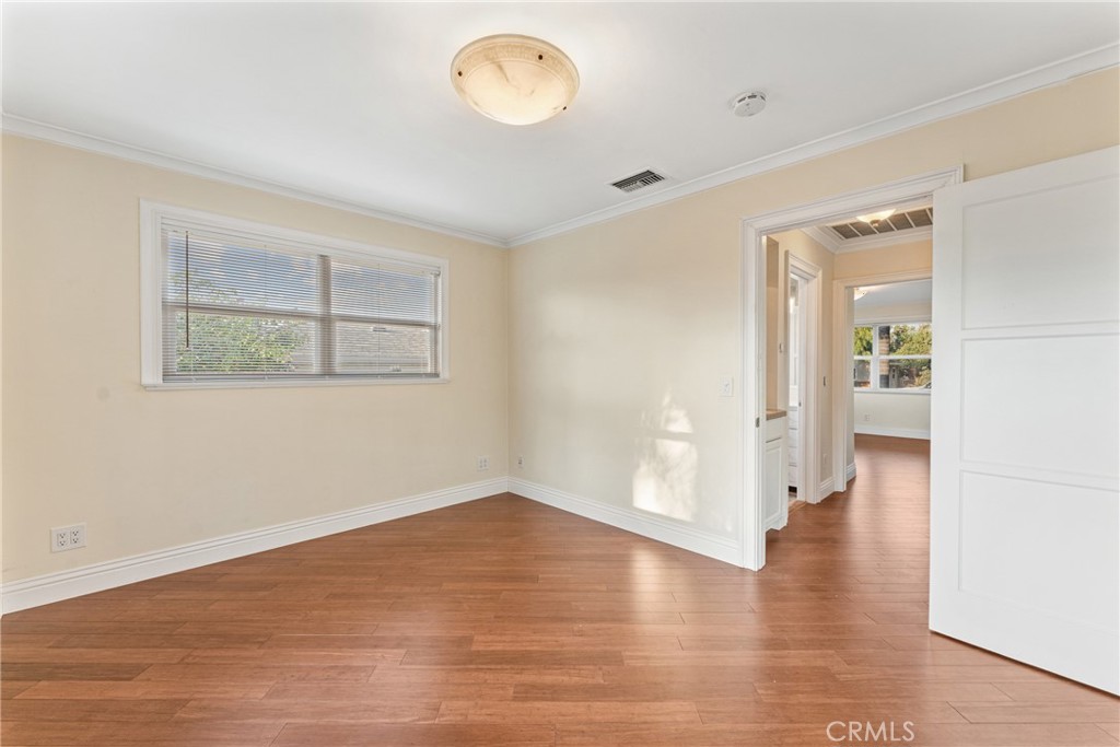510 Lime Street Redlands, CA 92374 - Photo 22 of 50 an empty room with wooden floor and windows