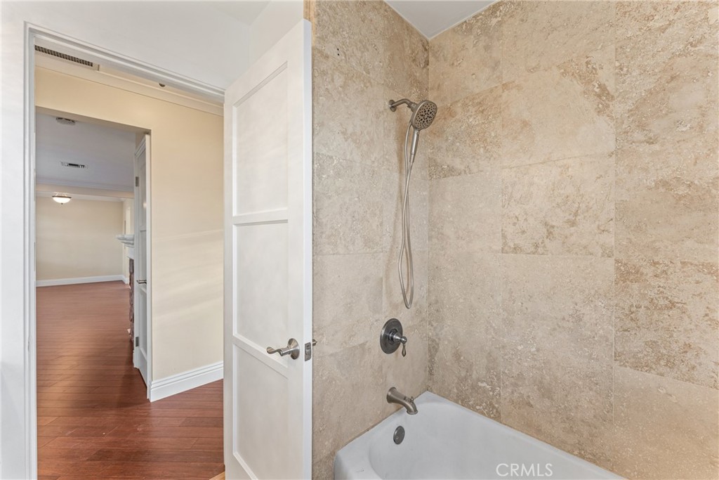 510 Lime Street Redlands, CA 92374 - Photo 27 of 50 a bathroom with a bathtub and a shower