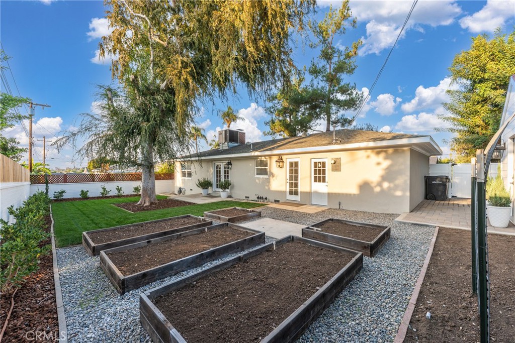 510 Lime Street Redlands, CA 92374 - Photo 32 of 50 a front view of a house with garden and patio