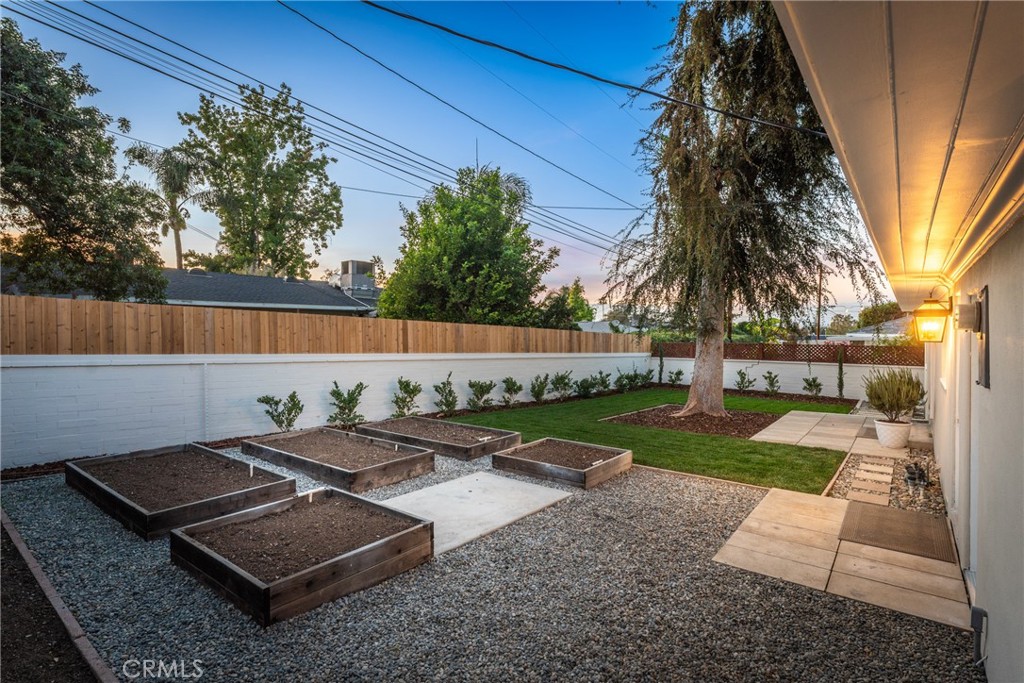 510 Lime Street Redlands, CA 92374 - Photo 38 of 50 a view of a backyard with couches under an umbrella