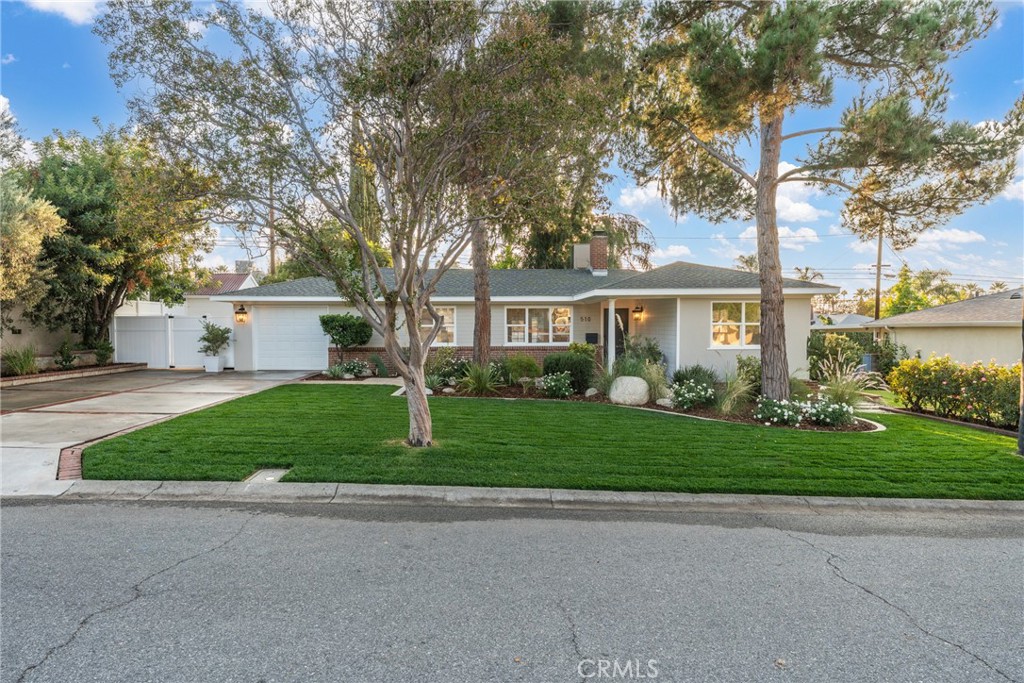 510 Lime Street Redlands, CA 92374 - Photo 4 of 50 a front view of a house with a yard and garage