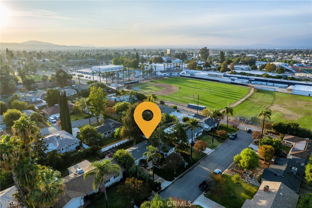 510 Lime Street Redlands, CA 92374 - Photo 46 of 50 an aerial view of a house with a swimming pool lake view and mountain view