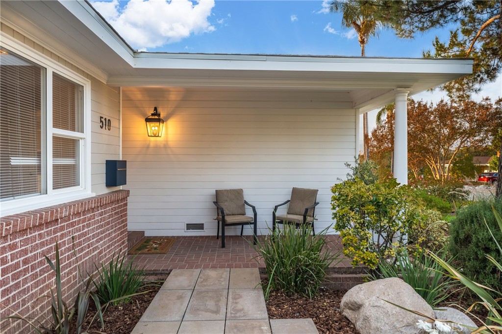510 Lime Street Redlands, CA 92374 - Photo 9 of 50 a view of a porch with chairs and potted plants