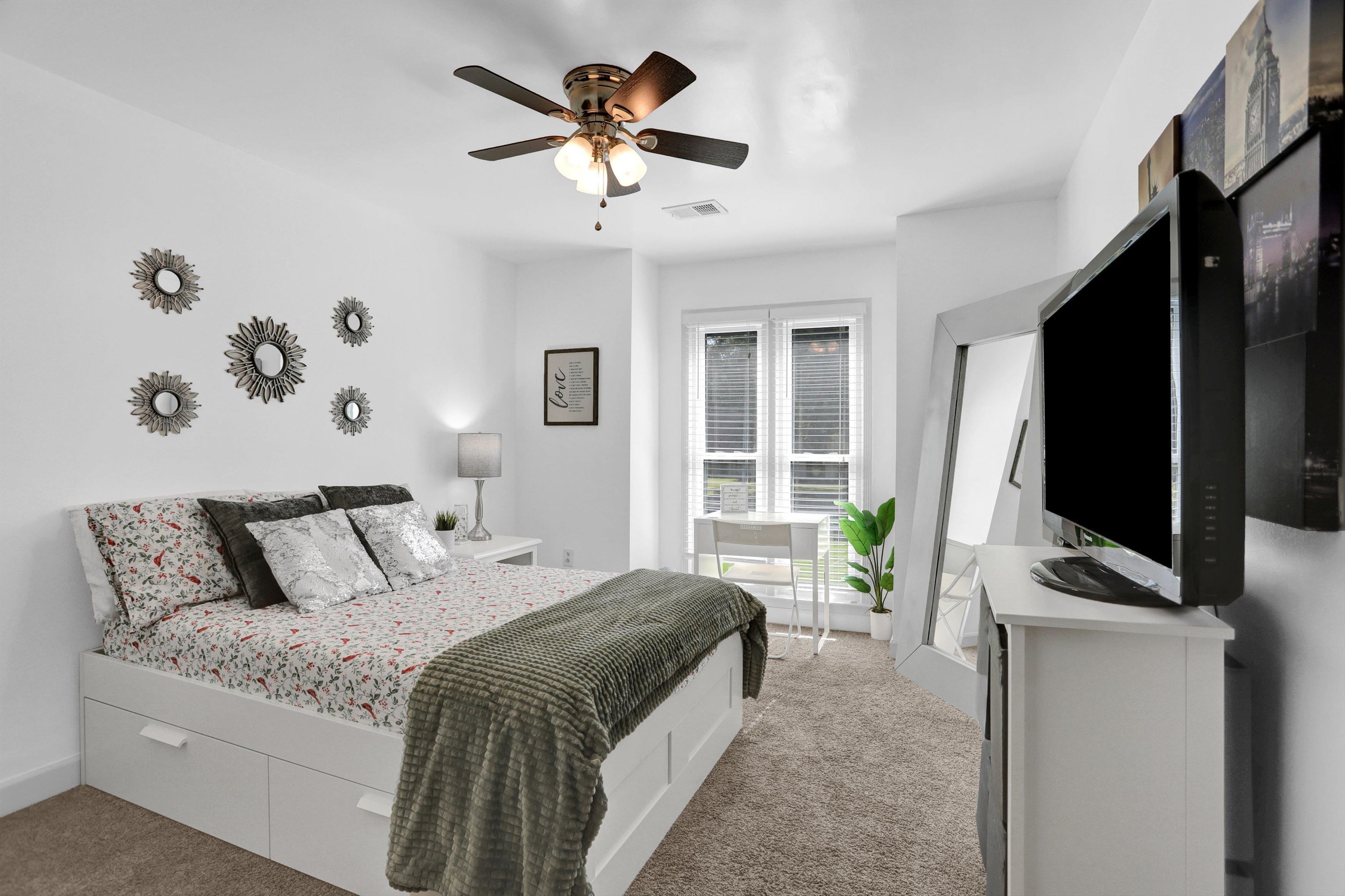 4045 Bartlett Country Road Bartlett, TN 38135 - Photo 20 of 40 a bedroom with a large bed and a flat tv screen on dresser