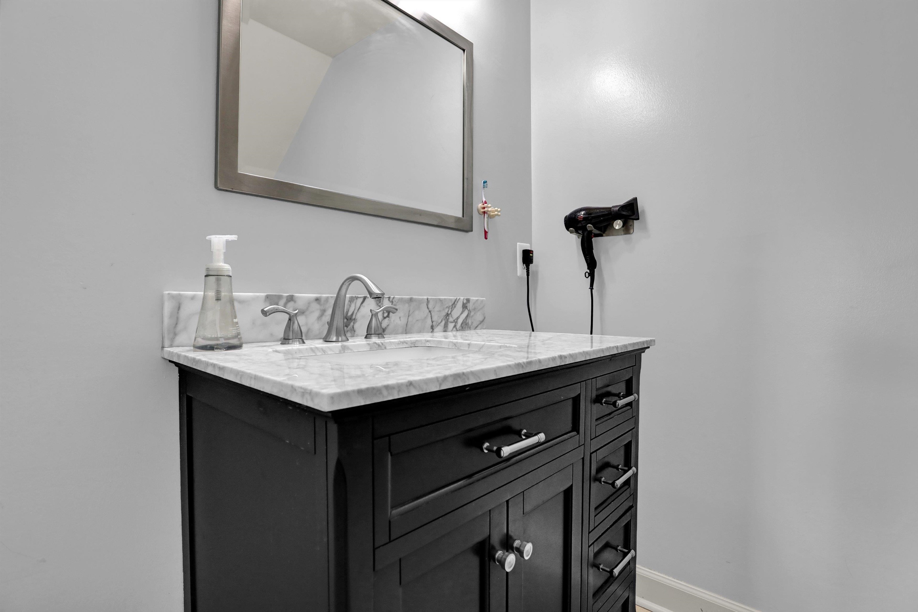 4045 Bartlett Country Road Bartlett, TN 38135 - Photo 26 of 40 a bathroom with a sink and a mirror