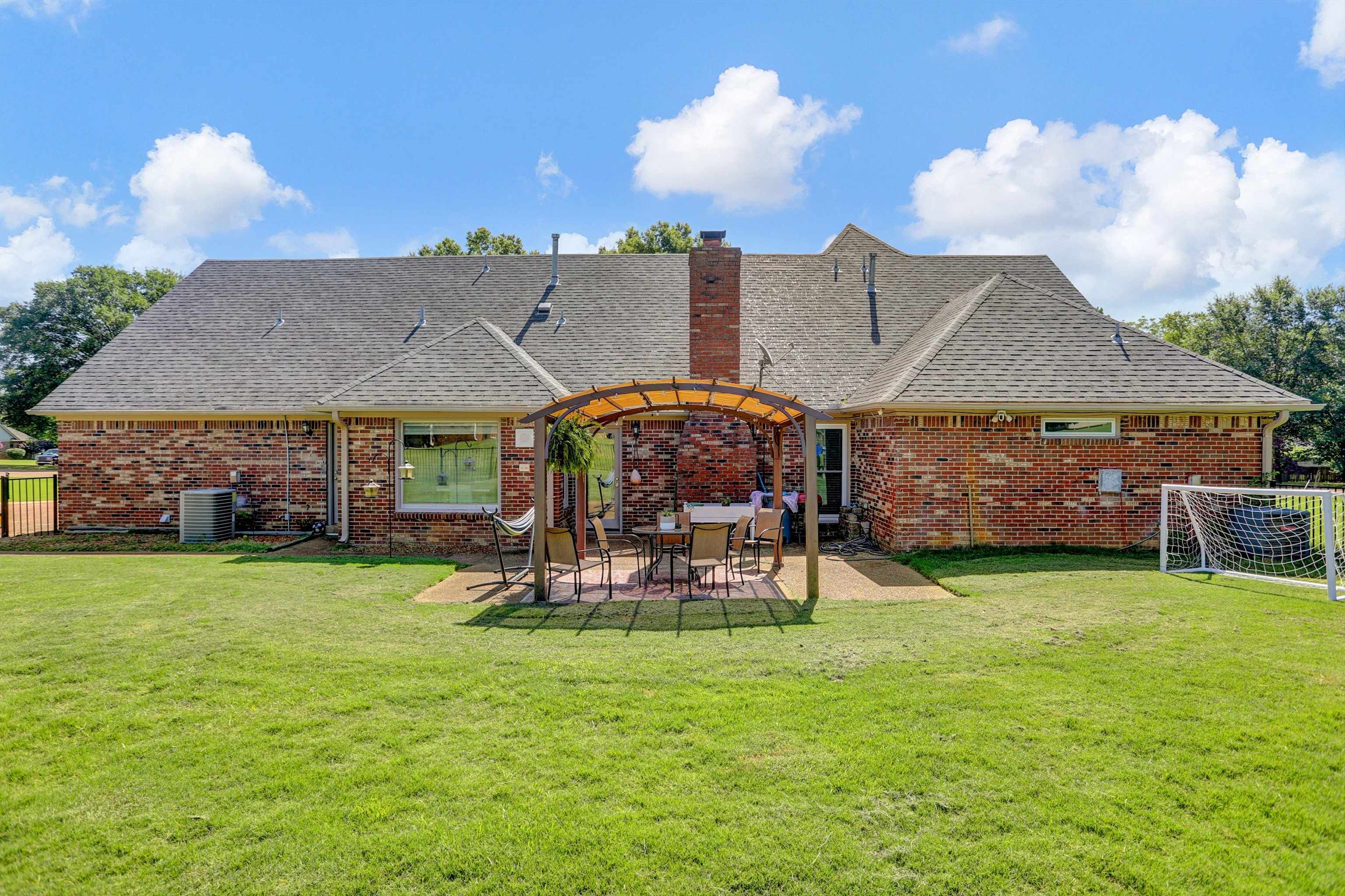 4045 Bartlett Country Road Bartlett, TN 38135 - Photo 27 of 40 a view of a house with backyard porch and sitting area