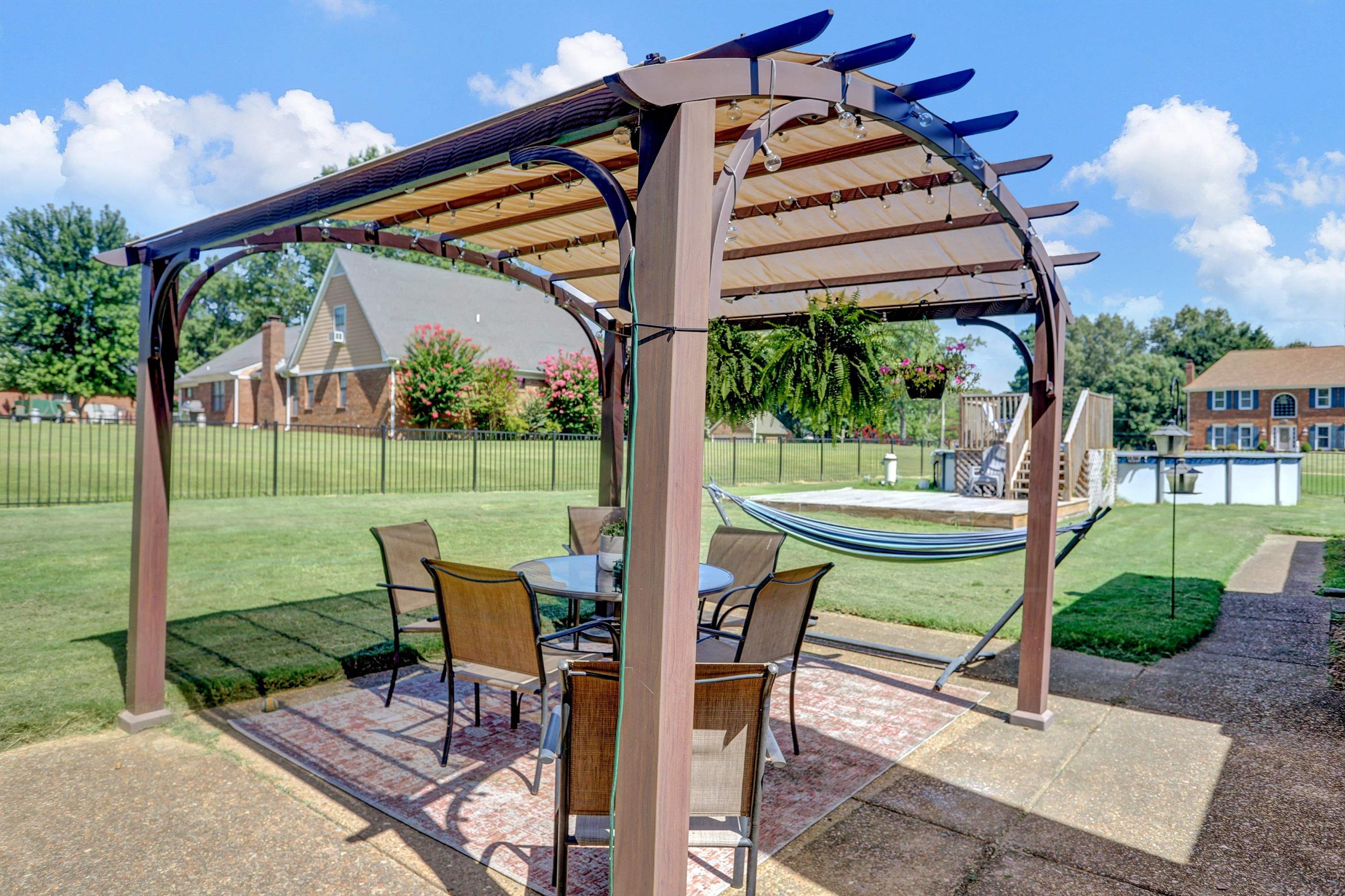 4045 Bartlett Country Road Bartlett, TN 38135 - Photo 28 of 40 a view of a patio with a table chairs and a backyard