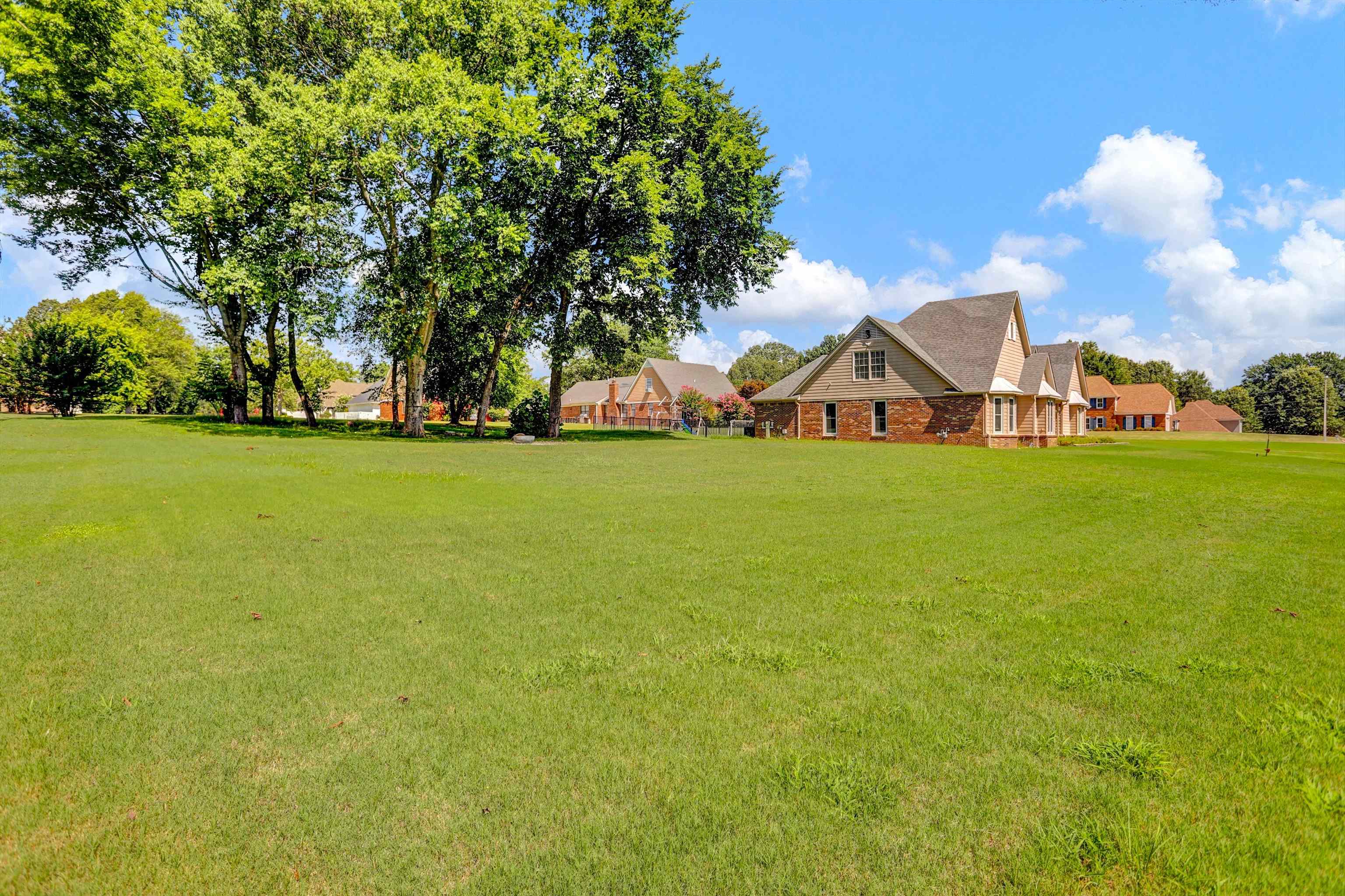 4045 Bartlett Country Road Bartlett, TN 38135 - Photo 30 of 40 a view of a large trees with flower garden in front of it