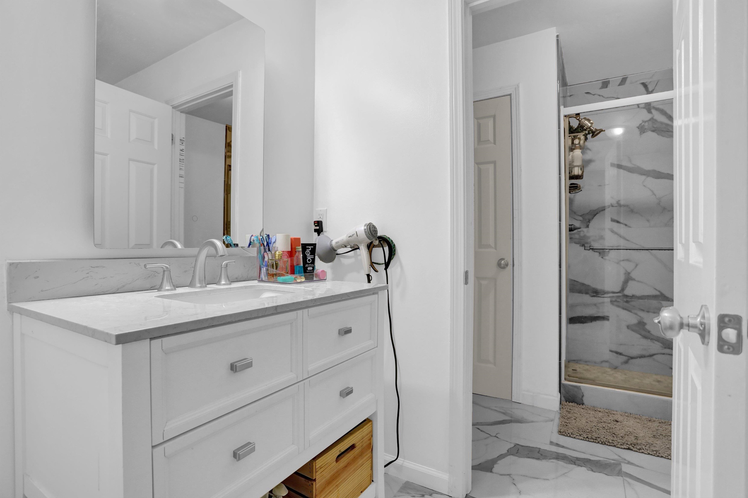 4045 Bartlett Country Road Bartlett, TN 38135 - Photo 37 of 40 a bathroom with a granite countertop sink mirror and shower
