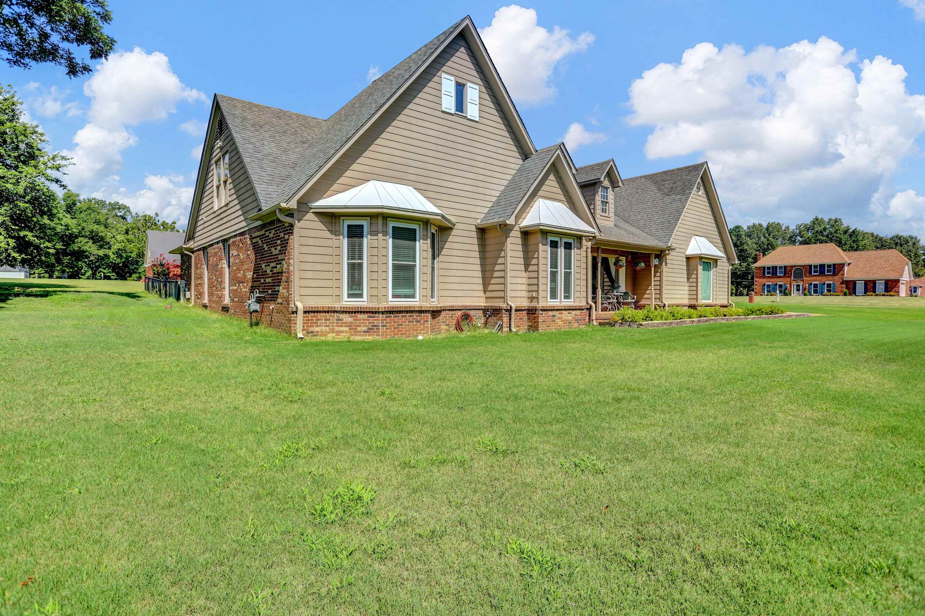 4045 Bartlett Country Road Bartlett, TN 38135 - Photo 7 of 40 a view of a house with a yard and sitting area