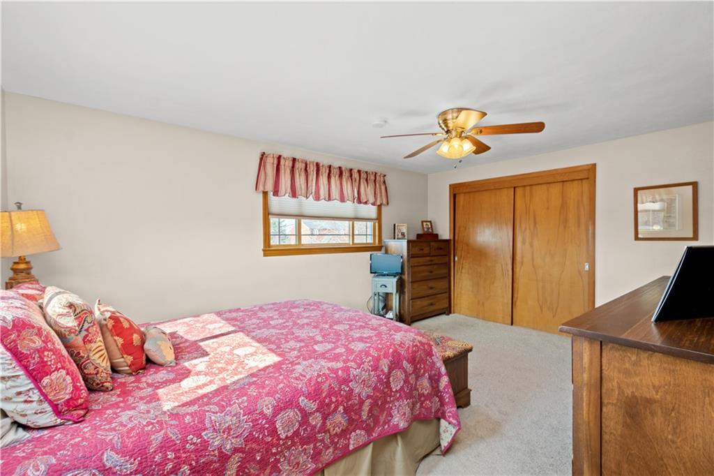 1735 Borland Road Pittsburgh, PA 15243 - Photo 11 of 25 a bedroom with a bed and a chandelier
