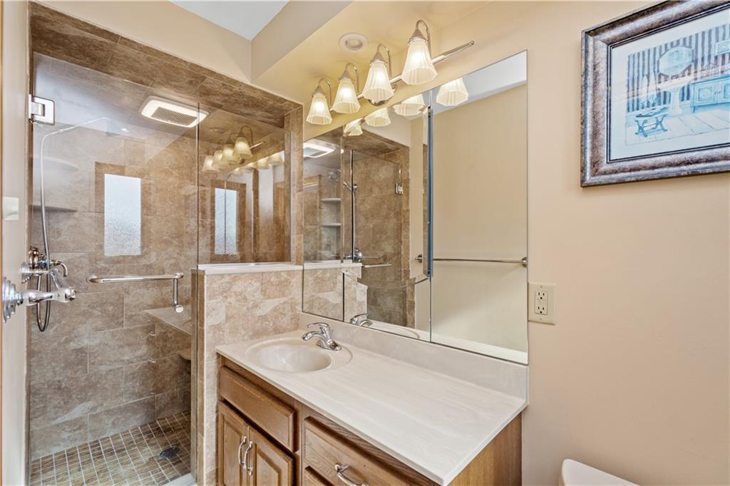 1735 Borland Road Pittsburgh, PA 15243 - Photo 12 of 25 a bathroom with a sink vanity and a mirror