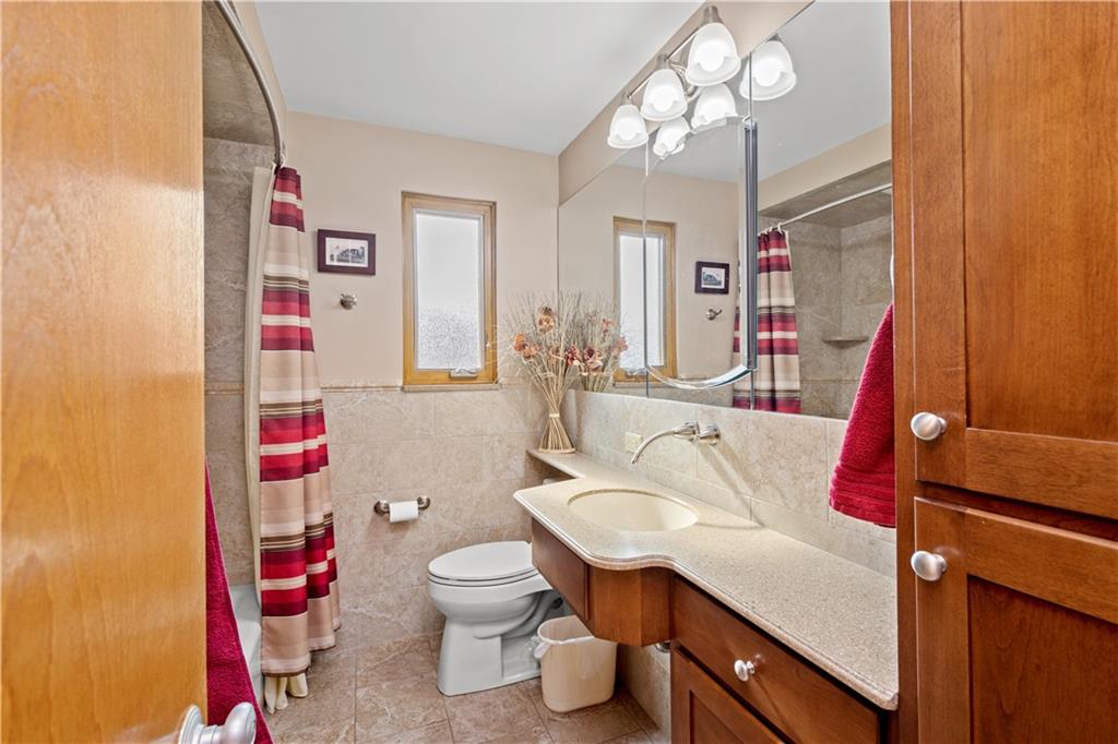 1735 Borland Road Pittsburgh, PA 15243 - Photo 14 of 25 a bathroom with a sink vanity mirror and toilet