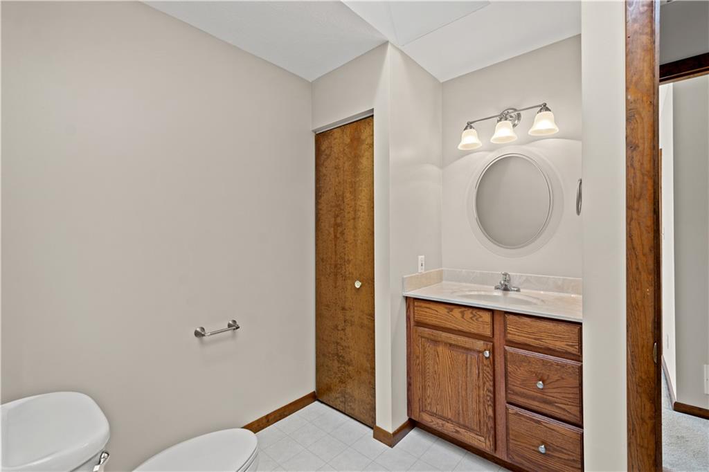 1735 Borland Road Pittsburgh, PA 15243 - Photo 17 of 25 a bathroom with a toilet a sink and mirror