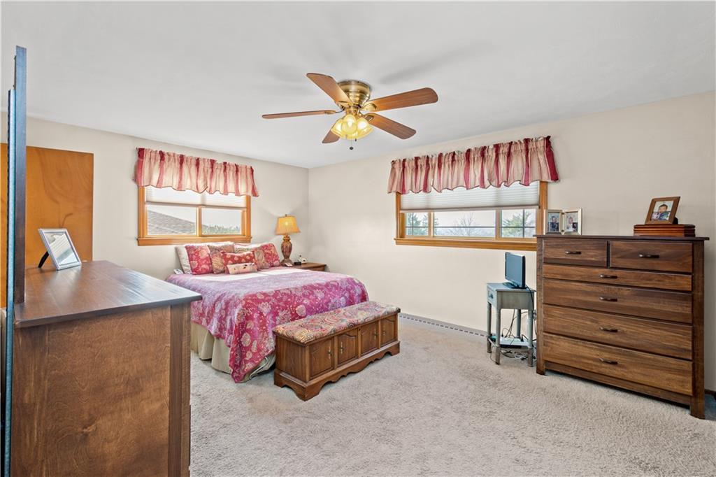 1735 Borland Road Pittsburgh, PA 15243 - Photo 10 of 25 a bedroom with a bed and a chandelier