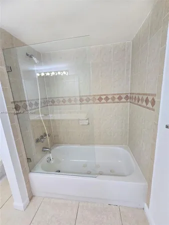 a bathroom with a bath tub