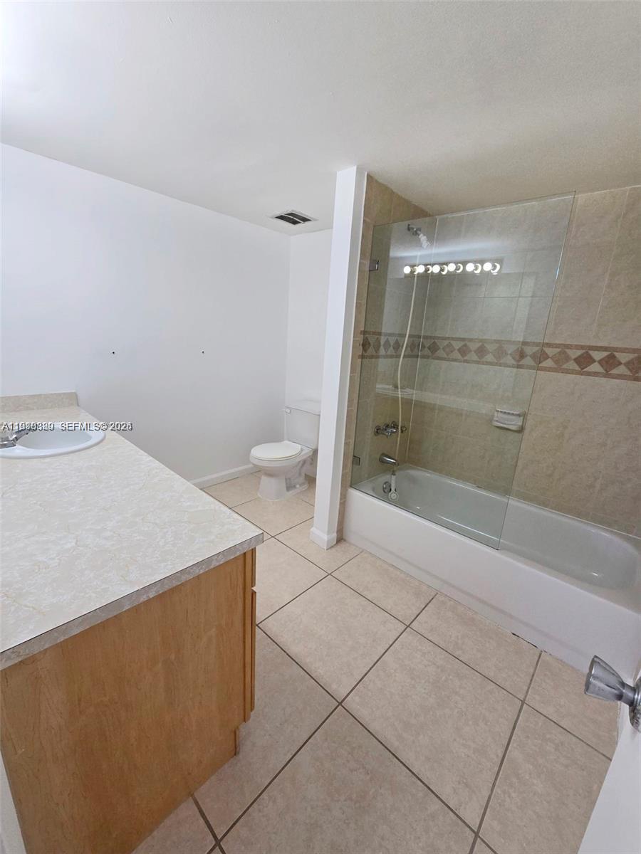 505 South Pine Island Road, Unit 401B Plantation, FL 33324 - Photo 13 of 15 a bathroom with a sink a toilet and shower
