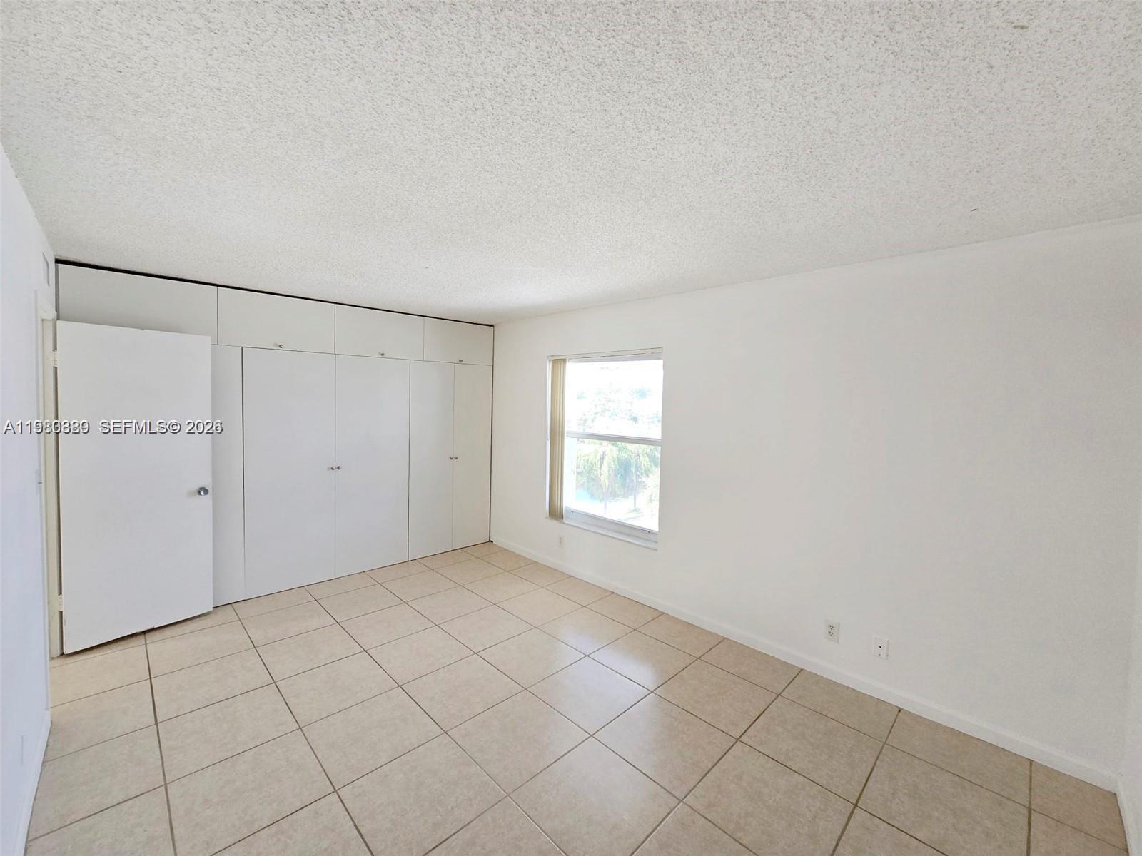 505 South Pine Island Road, Unit 401B Plantation, FL 33324 - Photo 10 of 15 a view of an empty room and window