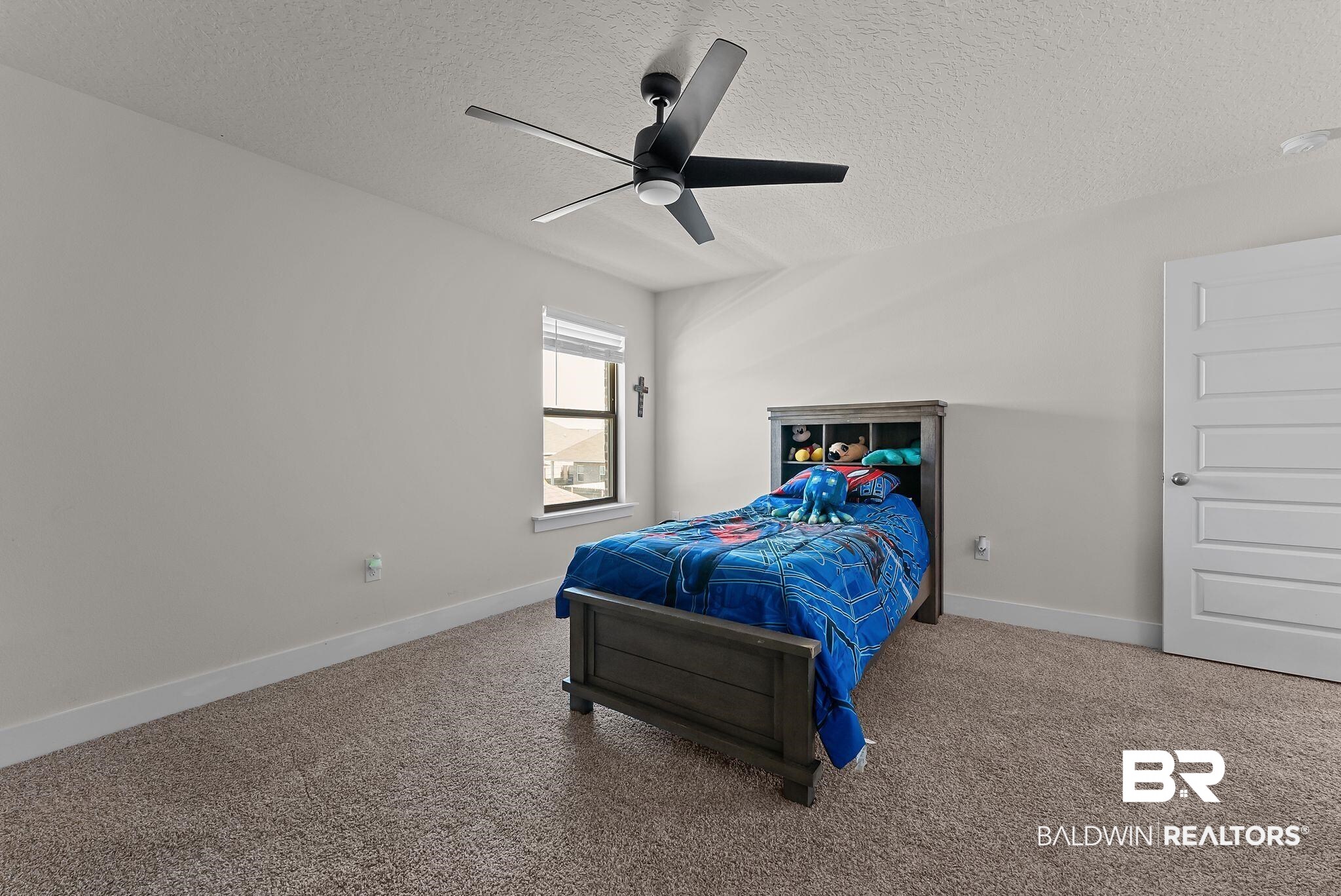 16607 Prado Loop Loxley, AL 36551 - Photo 26 of 46 Carpeted room featuring a modern ceiling fan with a light fixture, a window with horizontal blinds, and a white paneled door