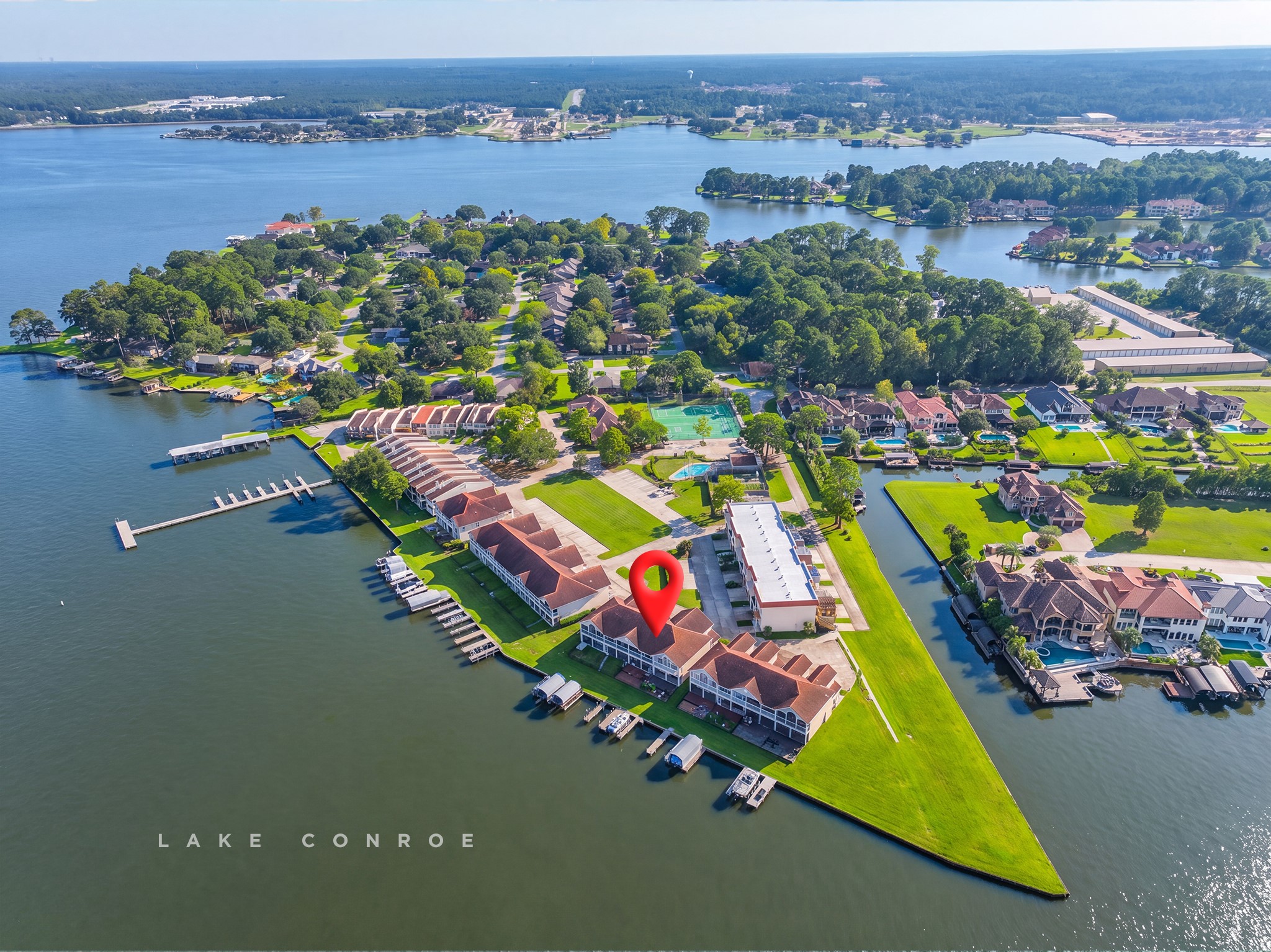 Aerial view of the waterfront community and surrounding Lake Conroe shoreline.