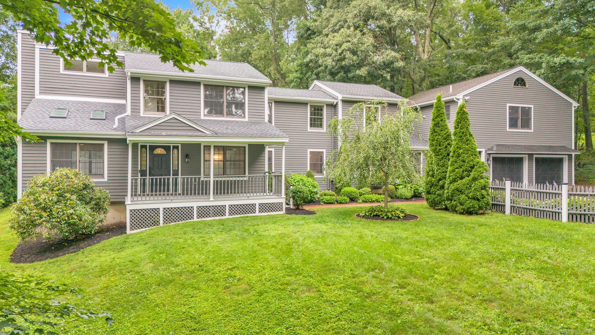 a front view of a house with a yard and porch