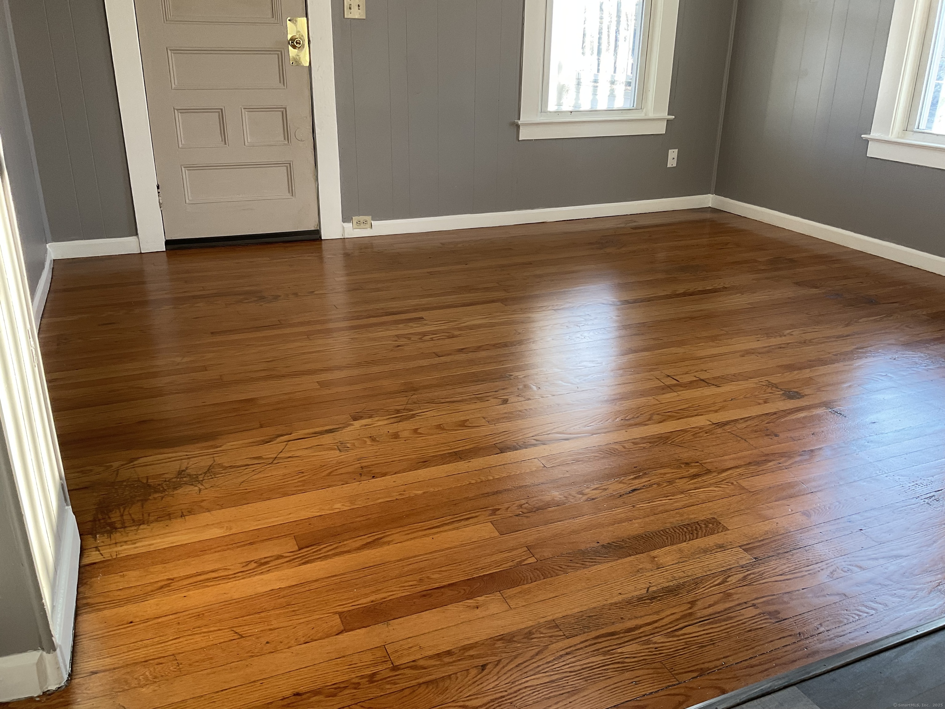 16 Lake Street, Unit 2W Middletown, CT 06457 - Photo 13 of 15 an empty room with wooden floor and windows