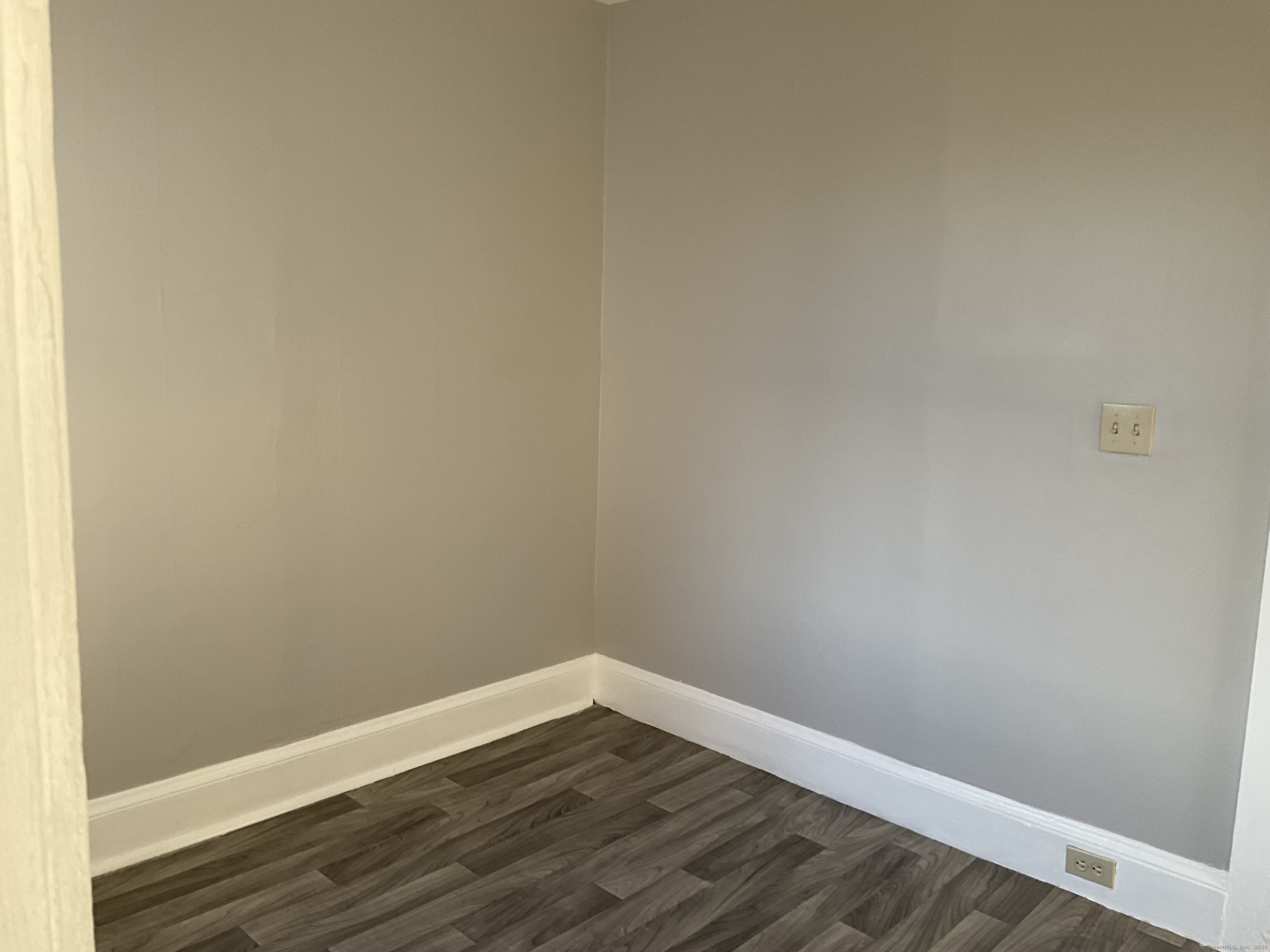 16 Lake Street, Unit 2W Middletown, CT 06457 - Photo 5 of 15 a view of an empty room with wooden floor