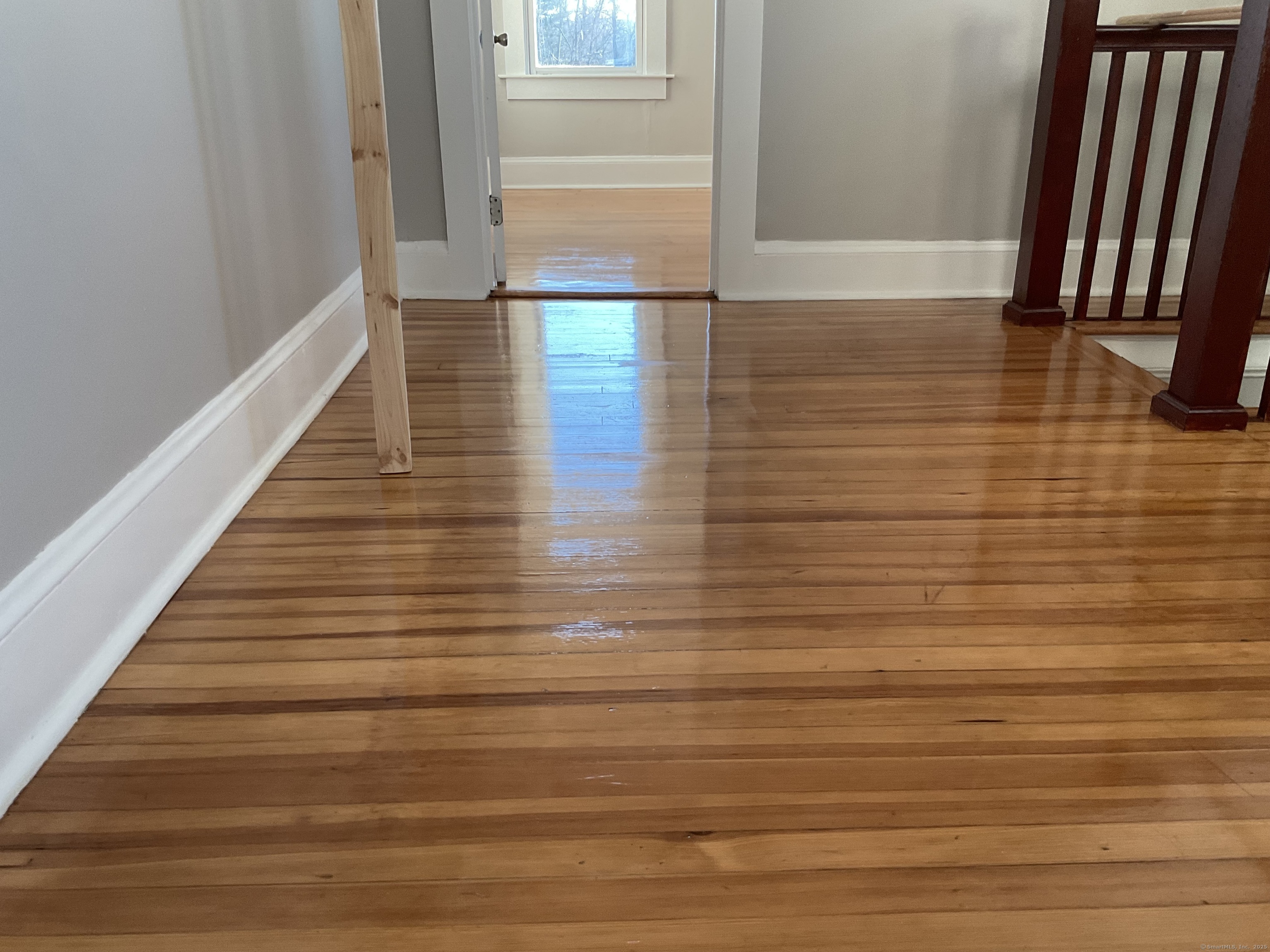 16 Lake Street, Unit 2W Middletown, CT 06457 - Photo 7 of 15 a view of a hallway with wooden floor and staircase