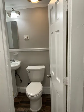 a bathroom with a toilet and a sink